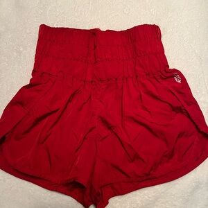 Free People movement Red shiny shorts.